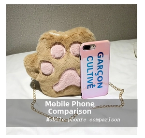 Plush cat paw crossbody bag in brown and pink shown next to a phone for size comparison