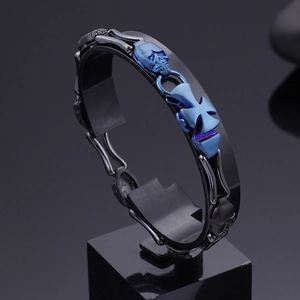 Punk style stainless steel skull bracelet with blue accents and gothic cross design