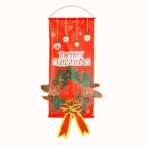 Close-up of red Merry Christmas banner with snowflake prints and bow decoration