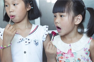 Bamboo heart fruit picks used by children for snack time in a casual setting
