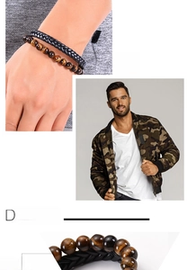 Detailed view of men's leather braided bracelet with natural tiger eye stone beads