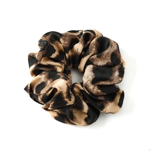 Leopard print satin scrunchie with elastic hair tie and vintage spotted pattern