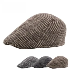 Macro detail of classic plaid newsboy cap showing thick textured wool blend fabric
