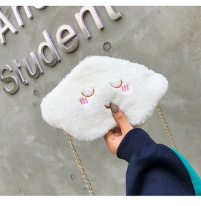 Close-up of white plush cloud bag with embroidery details and golden chain strap