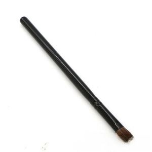 Detailed view of single makeup brush with black handle and soft brown synthetic bristles