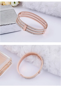 Close-up of rose gold hollow triple-layer bracelet with sparkling zircon stones