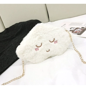 Close-up of white plush cloud bag with embroidery and golden metal chain strap