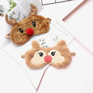 Detail of plush reindeer sleep masks with 3D antlers and red noses for Christmas gifts