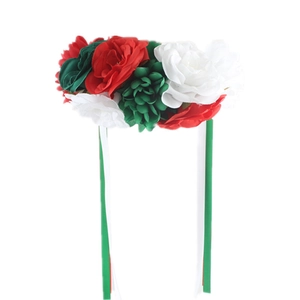 Close-up of handmade floral headband with red roses and elegant flowing ribbons