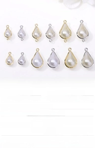 Macro detail of eco-friendly copper pearl drop pendants for handmade jewelry making