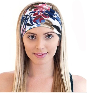 Close-up of a bohemian elastic headband with red and blue floral pattern on a female model