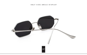 Side angle display of black octagonal sunglasses with a sleek silver metal frame
