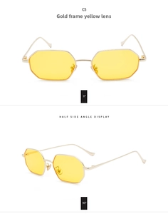 Detail view of octagon sunglasses with golden metal frame and yellow tinted lenses