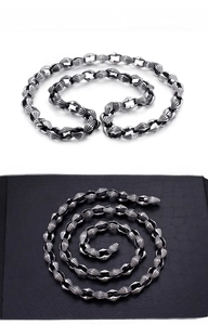 Macro shot of industrial style stainless steel chain with antique silver texture