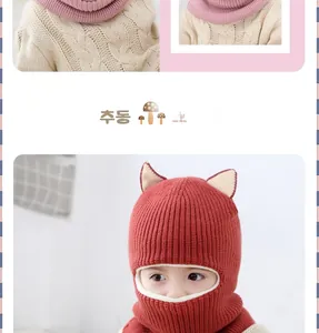 Detail of red fox knit hat and pink scarf with plush lining for kids winter warmth