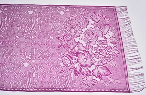 Detail of purple floral scarf featuring intricate lace patterns and long tassel fringe