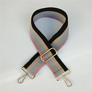 Detail of colorful striped woven replacement bag strap with golden metal swivel hooks