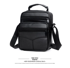 Detailed side view of black pebble leather business bag showing stitching and compartments
