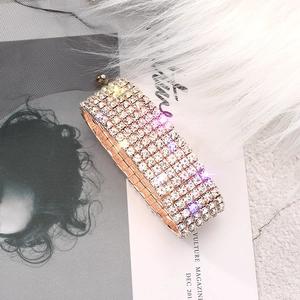 Detailed macro view of multi-row crystal rhinestone stretch bracelet in rose gold finish