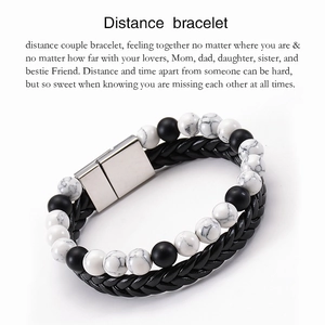 Detail of lava stone distance bracelet with braided leather and magnetic silver clasp