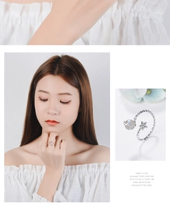 Close-up of adjustable star and moon open ring with sparkling crystal details