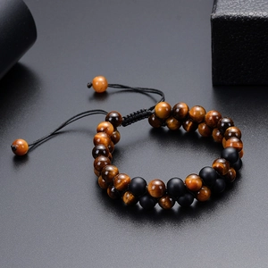 Detail of 8mm tiger eye and matte black stone double-layer beaded bracelet with cord