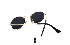 Detail of 180 degree flexible hinge on vintage gold metal oval frame sunglasses