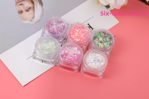 Detail view of 6-color glitter gel set for makeup and nail art on pink background