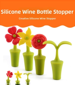 Detailed view of flower-shaped silicone wine stoppers sealing various glass bottles