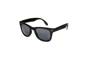Detailed side view of classic black folding sunglasses with signature metal rivet accents