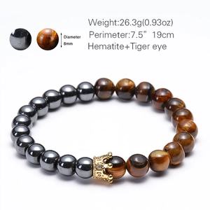 Close-up of 8mm hematite and tiger eye beads bracelet with a golden crown charm