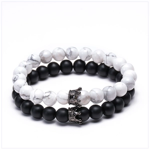 Detail of lava stone and white turquoise couple bracelets with cubic zirconia crowns