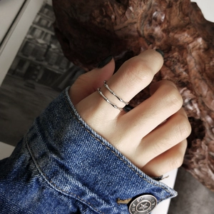 Detail of 925 sterling silver bamboo joint double layer ring on model's finger