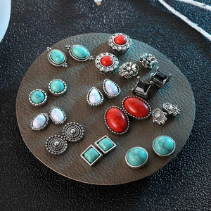 Retro bohemian turquoise and rhinestone earring set featuring mixed shapes on display