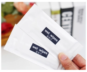 Close-up of portable individually wrapped airline wet wipes in white and blue packaging