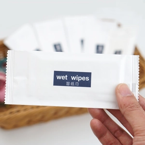 Individual pack of white non-woven wet wipes for hotel and travel sanitation