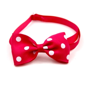 Adjustable red polka dot pet bowtie made of premium ribbed polyester fabric for dogs