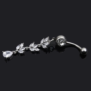 Detailed view of silver belly ring with zircon leaf clusters and a teardrop pendant