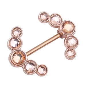 Detail of rose gold nipple barbell featuring champagne zircon crescent moon clusters