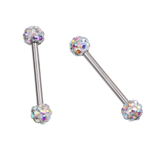 Macro detail of straight barbell piercing with sparkling zircon crystal ball ends