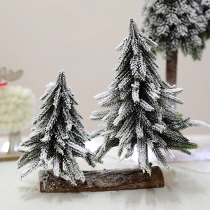 Mini snowy Christmas tree figurines on wooden base for festive tabletop decoration