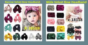 Macro detail of various wide and narrow velvet baby headbands with large bows