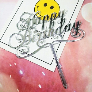 Silver mirror acrylic Happy Birthday cake topper detail on decorative background
