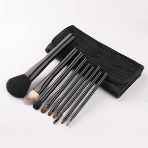 Set of 10 professional makeup brushes with a sleek black rollup travel case pouch