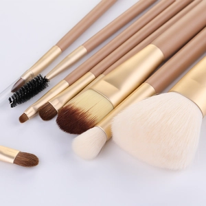 9-piece makeup brush set in champagne gold with matching pouch and soft bristles