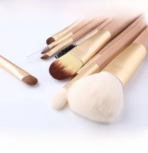 Detail of 9-piece makeup brush set featuring soft fiber bristles and matte pink handles