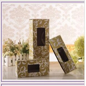 Three elegant gold floral gift boxes with clear windows for jewelry storage and display