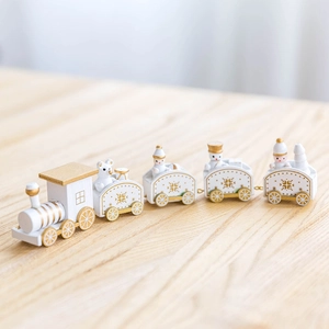 White and gold wooden Christmas train set featuring five carriages with cute cartoon figures