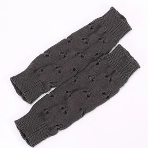 Detailed knit pattern on charcoal grey fingerless arm warmers with hollow-out design