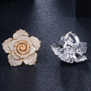 Detailed macro view of rose rings in gold and silver finish with pavé set cubic zirconia